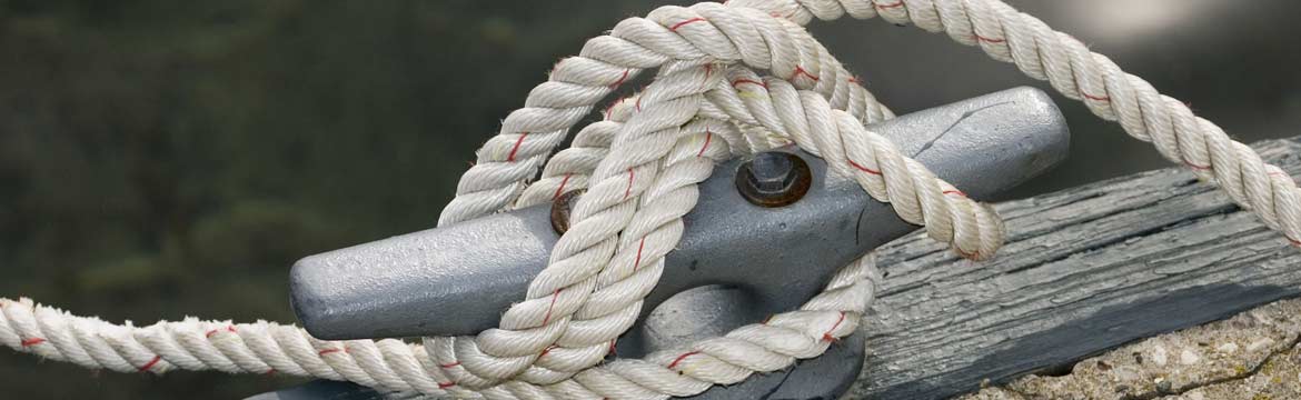 A dock cleat with some rope wrapped around it