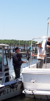 A vessel operator stopped and questioned by a marine patrol officer.