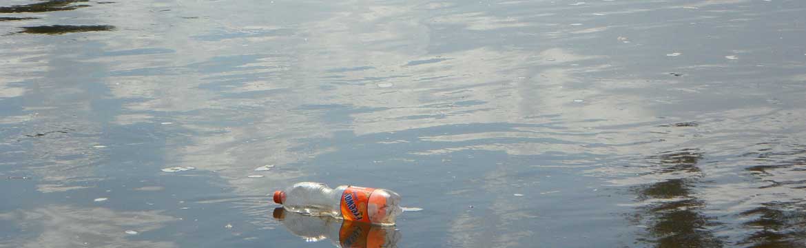 a plastic bottle floating in a lake