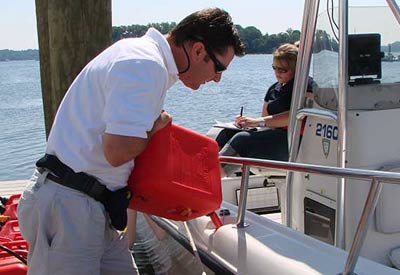 man filling a boat using a jerry jug