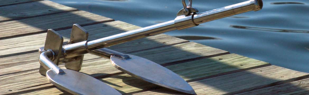 an anchor resting on a dock