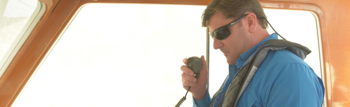 A man holds VHF radio reciever