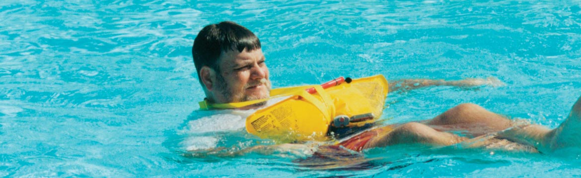 A man tests an inflatable life jacket