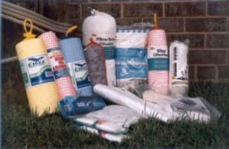 A collection of different fuel absorption products including bilge pillows and oil-absorbent pads.