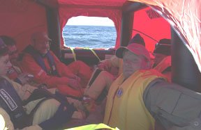 a crew in a life raft test an epirb