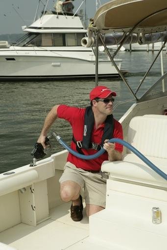 A boater refuels his pleasure craft.