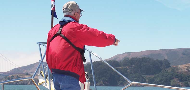 a spotter points out at during a crew overboard drill