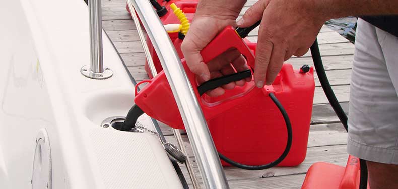 a man fills his fuel tank with a jerry jug