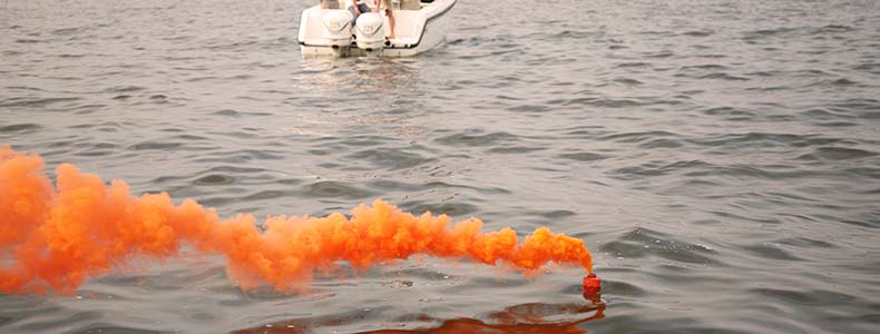 a smoke flare on the water