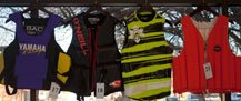 This image contains (left to right): Yamaha Ski Pro Impact Vest, O'neil Law, Liquid Force Cardigan, and Baltic Rekord.