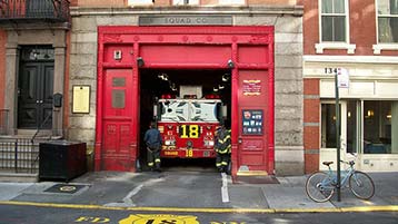 a red firetruck in its station