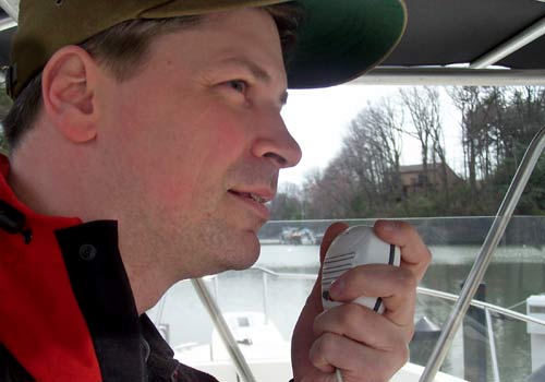 man using a vhf radio