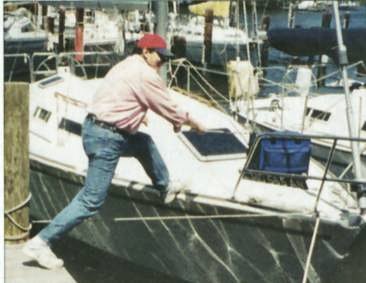 a man readies his boat for the sea